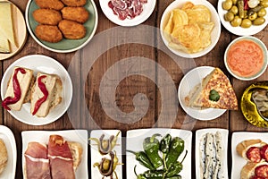 The food of Spain. Overhead photo of many different Spanish tapas with copy space