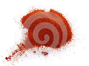 food spice pile of red ground PAPRIKA on white