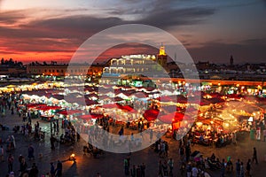 Food stalls at sunset on the Djemaa El Fna square. In the evening the large square fills with food stands, attracting crowds of