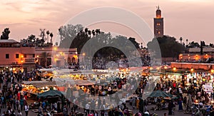 Food stalls at sunset on the Djemaa El Fna square. In the evening the large square fills with food stands, attracting crowds of