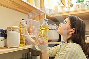 Food storage, woman taking food, sunflower oil for cooking