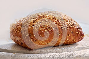 Food stuff. Closeup of freshly baked bread on a kitchen counter with copy space. Homemade wheat loaf ready to be sliced