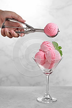 Food stylist use scooper decorating fake icecream