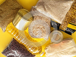 Food supply crisis. Canned food, rice, beans, buckwheat, pasta, oatmeal and sunflower oil. Food Delivery, Donation, Coronavirus