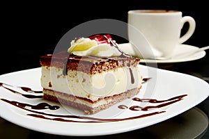 Food of sweet creamy chocolate cake with coffee.