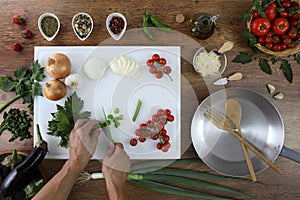 Food top view, hands cutting celery on white chopping board in kitchen wooden top work