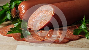 Food tray with delicious salami. Frame. Cutting sausage and cured meat on a celebratory table