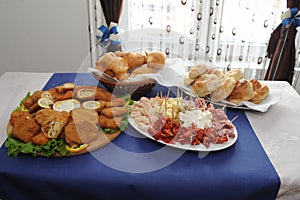 Food tray with delicious salami, pieces of sliced ham
