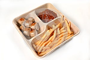 food tray french fries sausage white sausage and red sauce german food