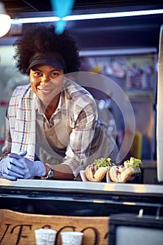 Food truck employee taking orders from customers