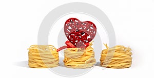 Food for Valentine`s Day. Italian pasta. Spaghetti Capellini, with a creative red heart with a bow, isolated on a white gray