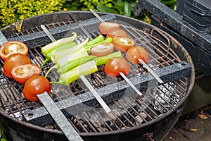 Food for vegans. Grilled tomatoes and peppers.