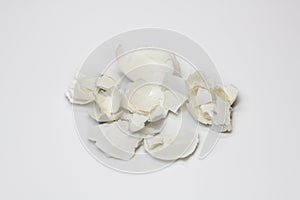 Food waste eggshell on a white background. Isolate. Close up. Waste for recycling. Responsible disposal of household food wastage