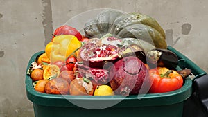 Food Waste in Grocery Store Retail. Discarded unsold damaged fruits and vegetables in packages. Food produced is wasted photo