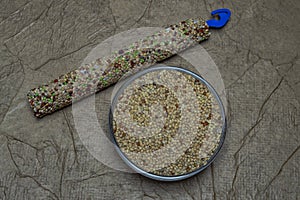 Food for wavy parrot white, yellow, black and red millet texture