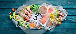 Foods containing omega 3. Vitamin Healthy foods: avocados, fish, shrimp, broccoli, flax, nuts, eggs, parsley. Top view.