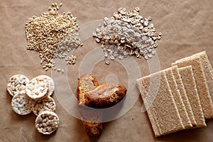 Foods high in carbohydrate. Healthy eating, diet concept. Bread, rice cakes, brown rice, oats.