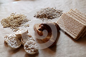 Foods high in carbohydrate. Healthy eating, diet concept. Bread, rice cakes, brown rice, oats.