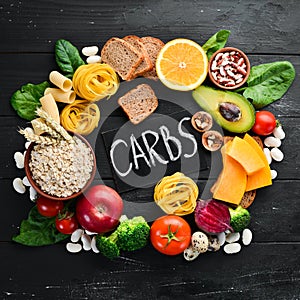 Foods high in carbohydrates: bread, pasta, avocado, flour, pumpkin, broccoli, beans, spinach. The concept of healthy eating.