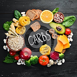 Foods high in carbohydrates: bread, pasta, avocado, flour, pumpkin, broccoli, beans, spinach. The concept of healthy eating. photo