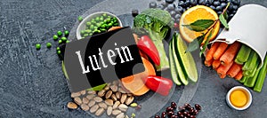 Foods high in lutein on dark background