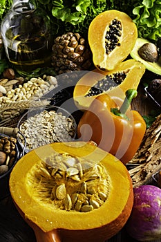 Foods rich in vitamin E such as wheat germ oil or olive oil, dried apricots, pine nuts, papaya,hazelnuts, almonds, pumpkin,rosehip