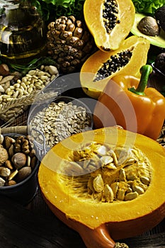 Foods rich in vitamin E such as wheat germ oil or olive oil, dried apricots, pine nuts, papaya,hazelnuts, almonds, pumpkin,rosehip