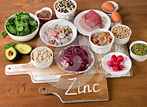 Foods with Zinc mineral on a wooden table.