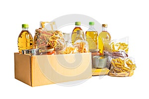 Foodstuff for donation isolated on white background, storage and delivery. Various food, pasta, cooking oil and canned food