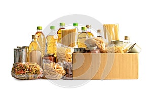 Foodstuff for donation isolated on white background, storage and delivery. Various food, pasta, cooking oil and canned food