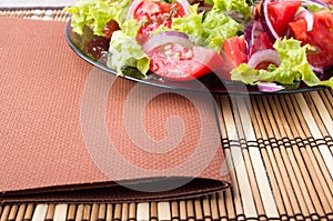 Foodstyle background closeup view of a plate with fresh salad