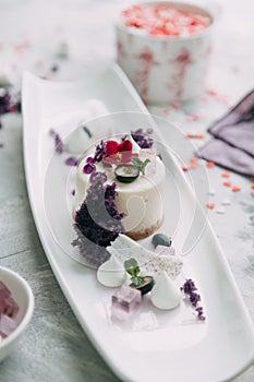 Foodstyling with decor and sweets in purple photo