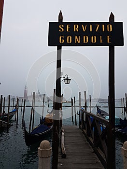Servizio Gondole in foggy Venice, Italy photo