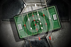 Foosball - Mini table football game on an old soccer ball