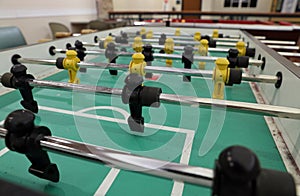 Foosball table with figurines for playing games photo
