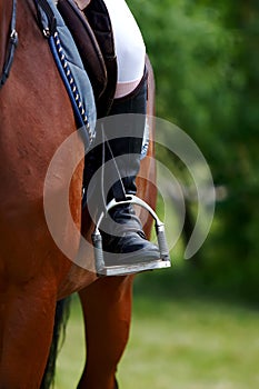 Foot of the athlete in a stirrup