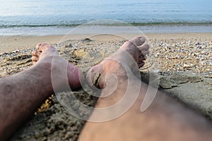 foot on beach background