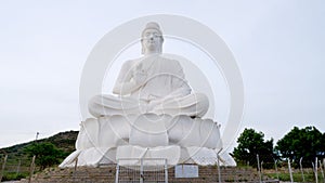 40-foot Buddha statue seated on lotus throne at Belum Caves, Kolimigundla,