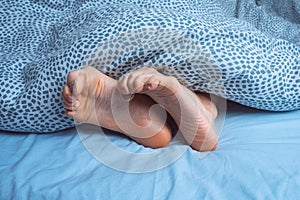 Foot cramps, leg cramps or muscular spasm. Foot pain or foot ache at night photo