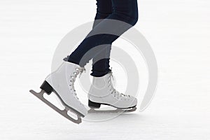 Foot ice-skating girls on the ice rink