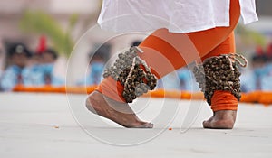 Foot of an Indian woman dancing kathak on the stage photo