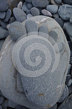 Foot made out of pebblestones