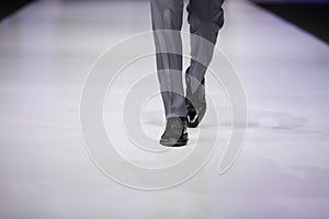 Foot of male model on catwalk