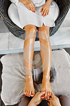 Foot Massage. Body Skin Care. Masseur Massaging Feet. Spa photo
