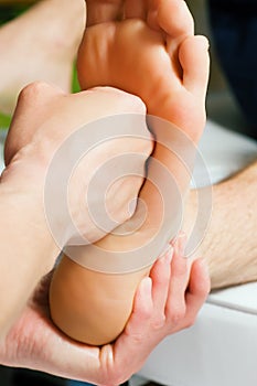 Foot massage with fist