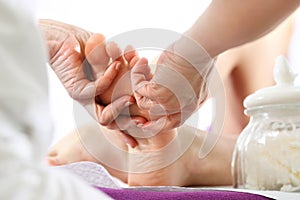 Foot massage in the spa salon