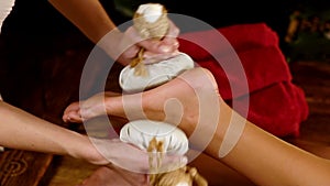 Foot massage by thai ball compress.