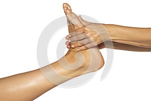 Foot massage on white background