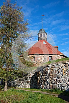 At the foot of the medieval round tower of Lars Torstensson. Korela Fortress, Priozersk. Russia