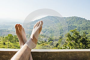 Foot with mountain nature background